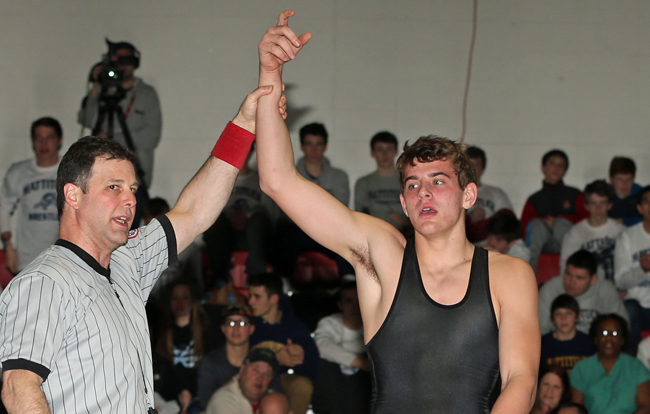 James Hoeg of Mattituck has his arm raised as the 160-pound champion Friday night. (Credit: Daniel De Mato)