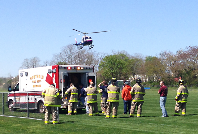 A Suffolk County Police helicopter lands at Cochran Park in Peconic Thursday. (Credit: Joe Werkmeister)