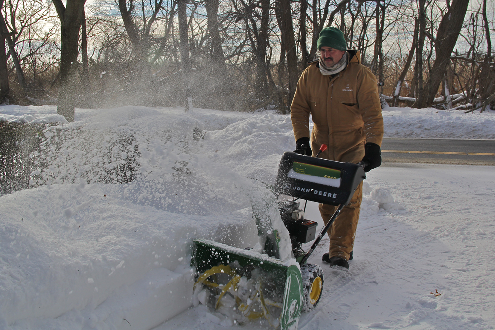 Joseph Henry of Greenport and his money maker, a John Deere snow blower.