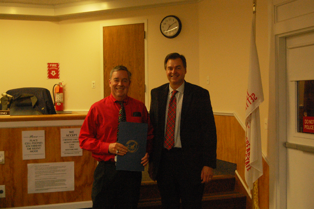 Dave Bergen (left) and Suffolk County Legislator Al Krupski after Mr. Bergen received his proclamation for his ten years of service as a Southold Town Trustee (Credit: Nicole Smith).